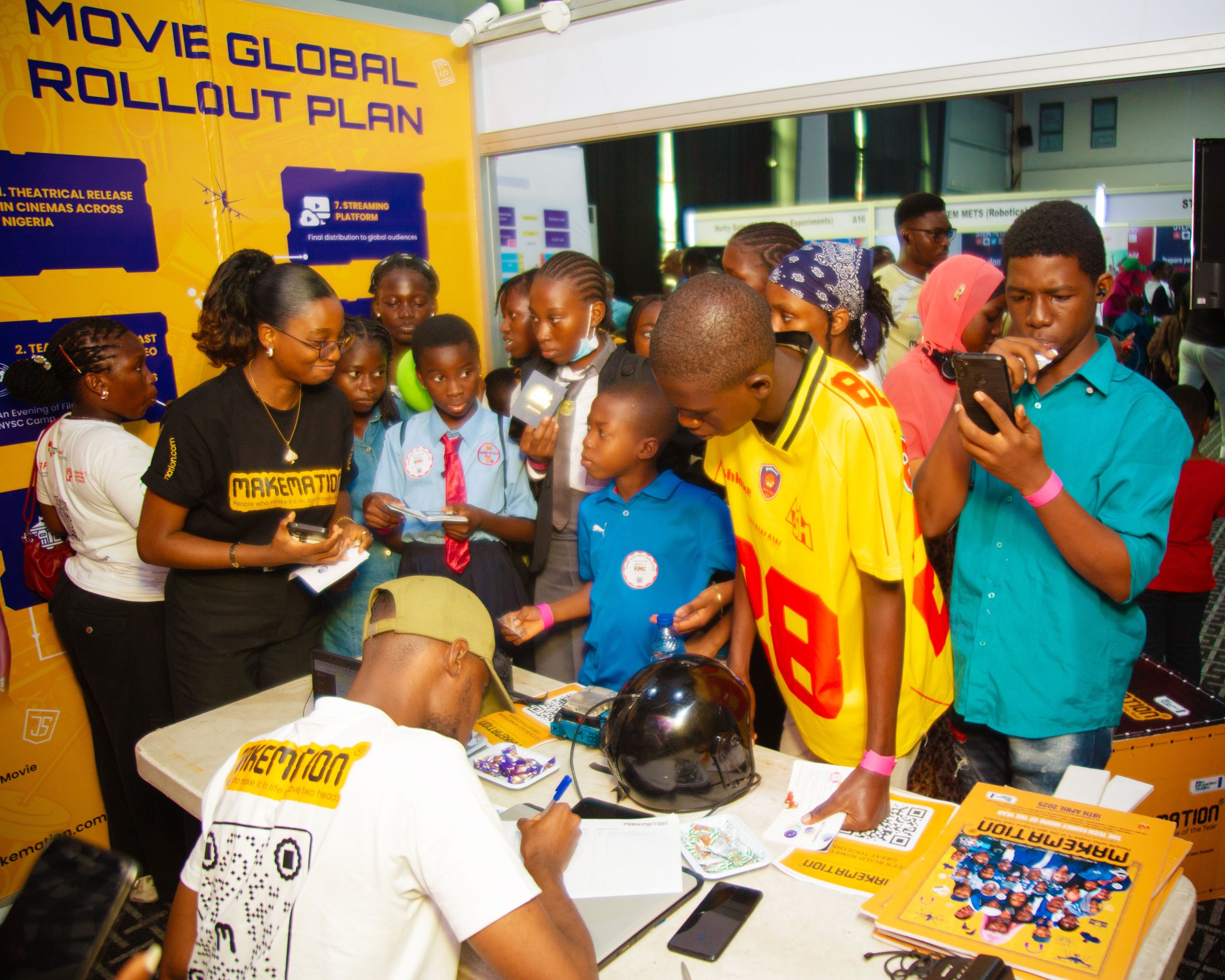 A MAKEMATION Team Rep attending to the Children @ STEM Africa Fest 2025