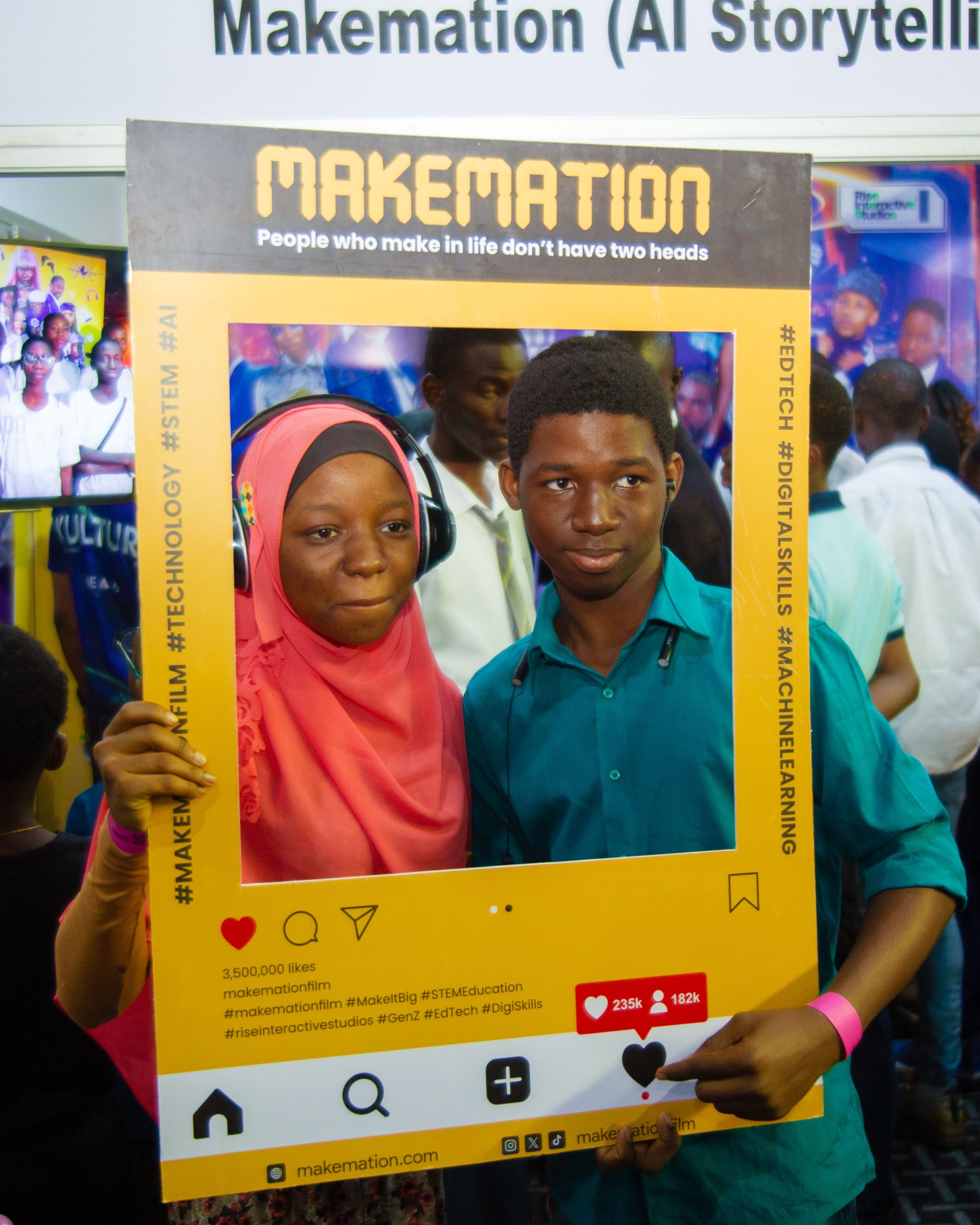 Children posing with MAKEMATION Photo Booth cutouts